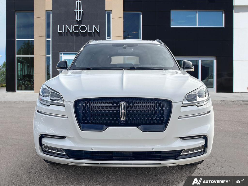 USED 2022 Lincoln Aviator Reserve - Pristine White Tri-coat Exterior / ROAST, PREMIUM LEATHER HEATED/VENTILATED CAPTAIN'S CHAIRS Interior - $48,942 - Stock #E60988A - VIN 5LM5J7XC3NGL16432 - Photo 2