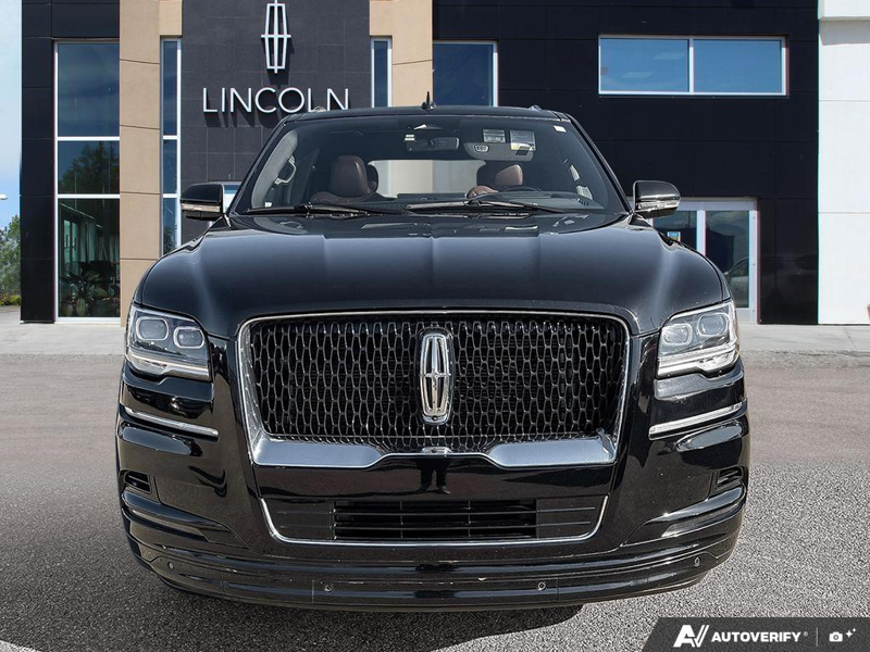USED 2022 Lincoln Navigator Reserve - Infinite Black Metallic Exterior / BLACK ONYX/ROAST PREMIUM LEATHER Interior - $55,976 - Stock #E60212A - VIN 5LMJJ2LT3NEL09385 - Photo 2