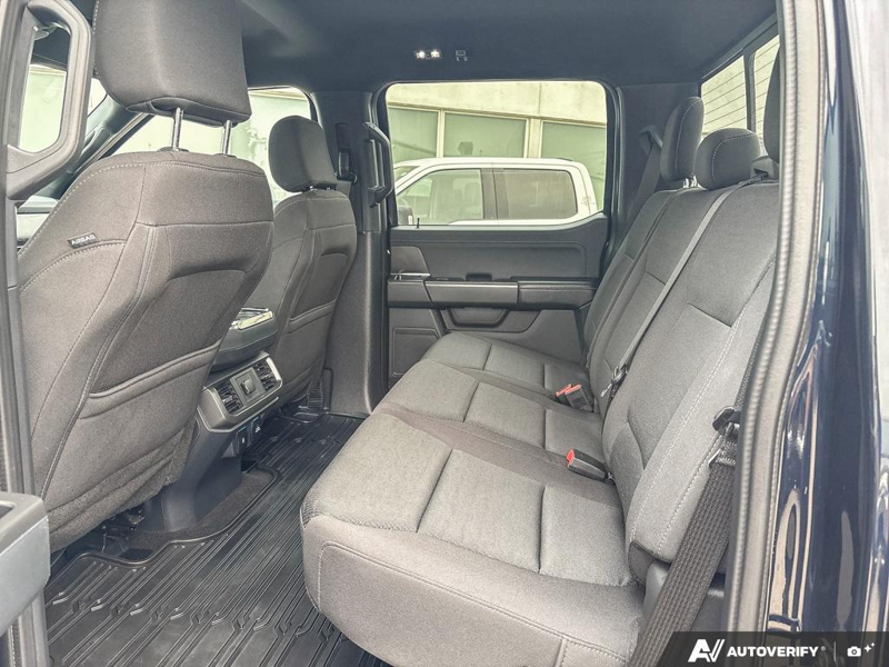 USED 2024 Ford F-150 XLT - Antimatter Blue Metallic Exterior / BLACK, UNIQUE SPORT CLOTH 40/CONSOLE/40 FRONT-SEATS Interior - $53,910 - Stock #EP4735 - VIN 1FTFW3L85RFA38877 - Photo 23