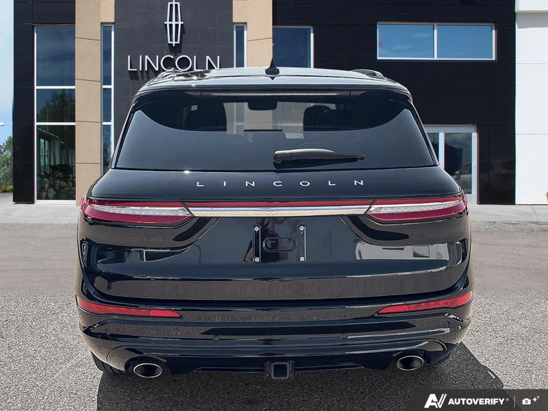 USED 2025 Lincoln Corsair Grand Touring - Infinite Black Metallic Clearcoat Exterior / EBONY, PREMIUM LEATHER-TRIMMED HEATED CAPTAIN'S CHAIRS Interior - $50,908 - Stock #EP4719 - VIN 5LMTJ5DZ1SUL12154 - Photo 5
