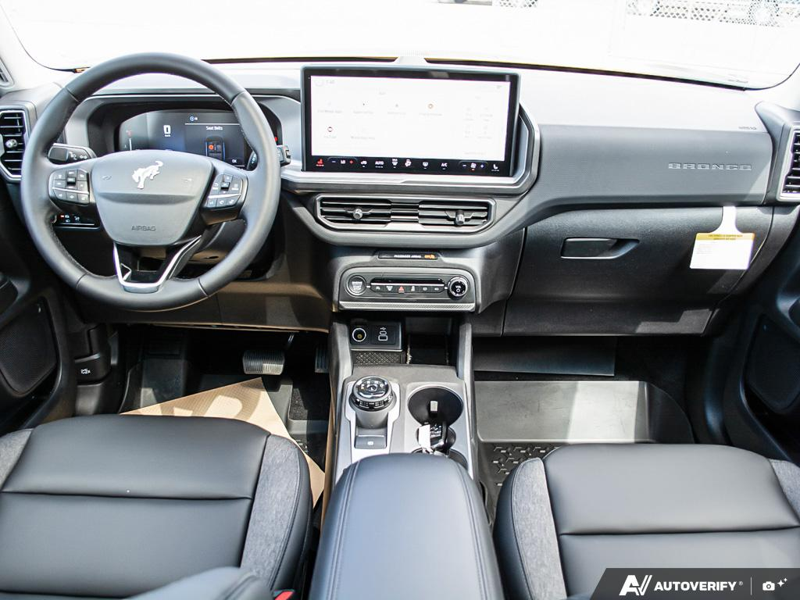 NEW 2026 Ford Bronco Sport Big Bend - Orange Fury Metallic Tri-coat Exterior / EBONY, PREMIUM TRIMMED HTD FR SPORT CONTOUR BUCKET SEATS Interior - $40,849 - Stock #E60242 - VIN 3FMCR9BN6TRE10964 - Photo 26