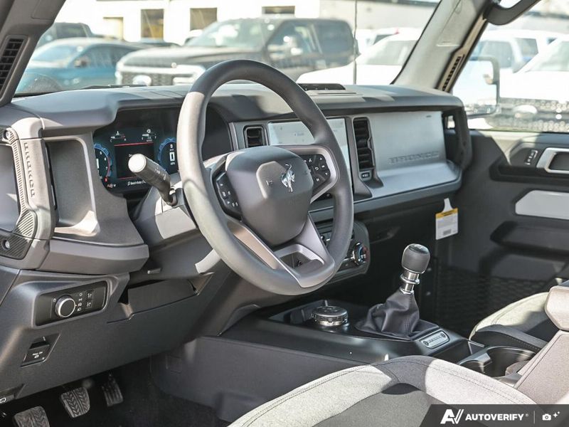 NEW 2026 Ford Bronco Base Sasquatch Manual - Desert Sand Exterior / BLACK CLOTH GREY Interior - $62,708 - Stock #E60575 - VIN 1FMDE6AH0TLA75175 - Photo 13