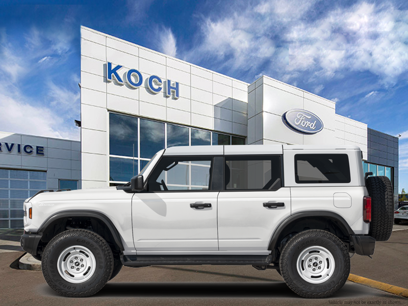 NEW 2026 Ford Bronco Heritage Edition - Oxford White Exterior / NAVY PIER, PLAID CLOTH FRONT HEATED BUCKET SEATS Interior - $68,096 - Stock #E61116 - VIN 1FMEE4DP0TLB53272 - Photo 1