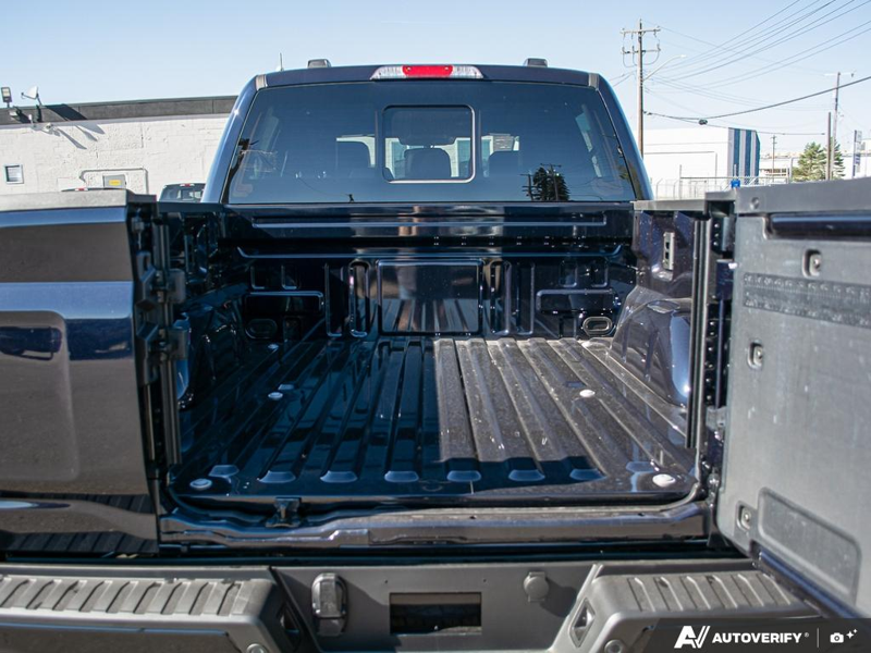 NEW 2026 Ford F-150 LARIAT - Antimatter Blue Metallic Exterior / BLACK, ACTIVEX TRIMMED 40/CONSOLE/40 FRONT SEATS (B) Interior - $87,962 - Stock #E61061 - VIN 1FTFW5L54TFB70859 - Photo 11