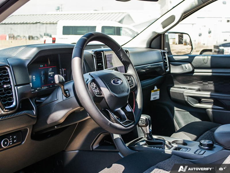 NEW 2026 Ford Ranger XLT - Oxford White Exterior / EBONY PREMIUM CLOTH Interior - $57,869 - Stock #E60297 - VIN 1FTER4HP7TLE04386 - Photo 13